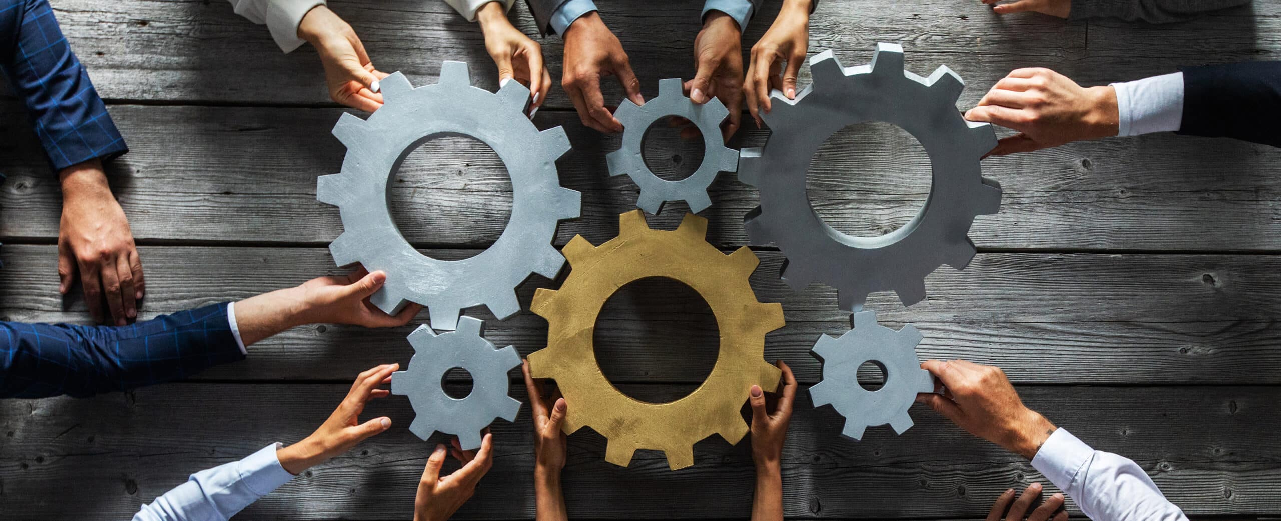 Group,Of,Business,People,Joining,Together,Silver,And,Golden,Colored